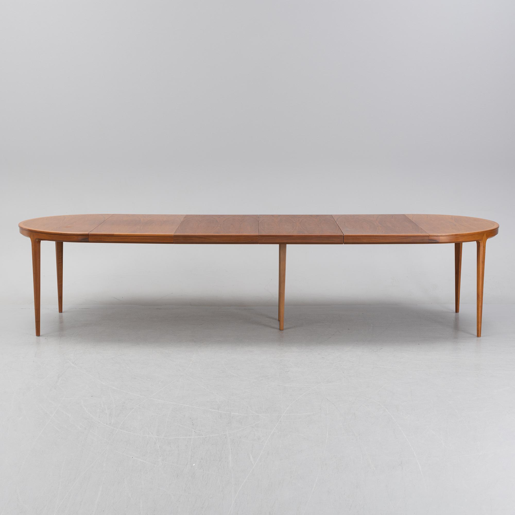 Bertil Fridhagen, a 'Diamant' walnut veneered dining table, with four additional leaves.  Bodafors.