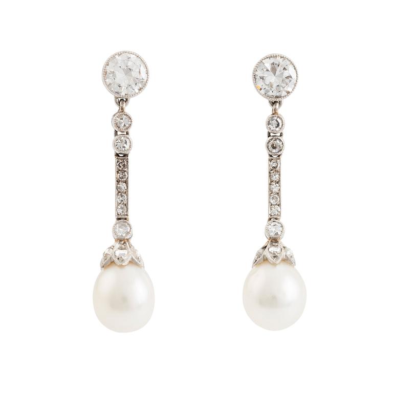 A pair of platinum pearl earings.