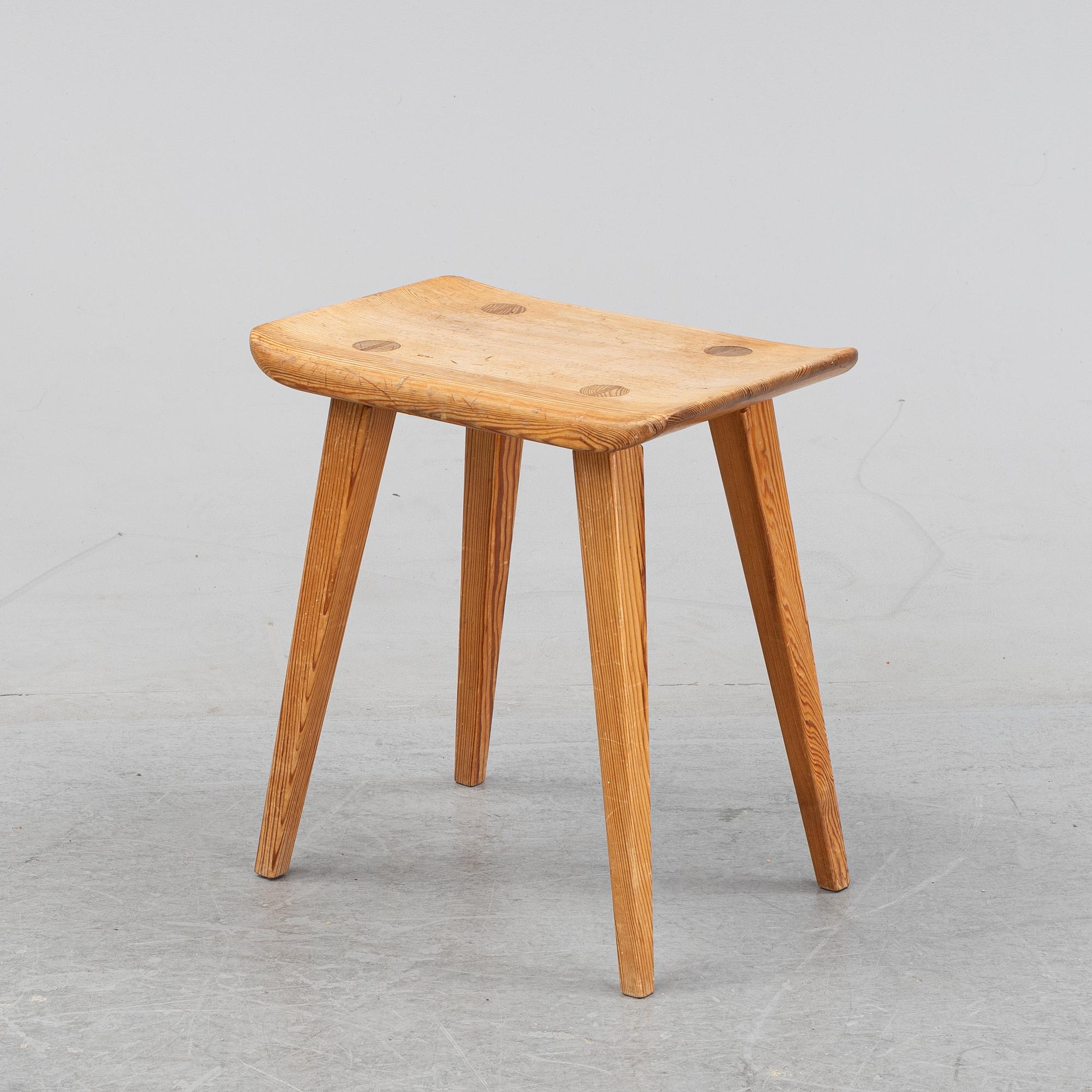 A pine stool by Carl Malmsten for Karl Andersson.