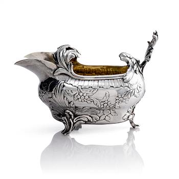 288. A Swedish Rococo 18th century parcel-gilt silver cream-jug, mark of Johan Abbelin, Gothenburg 1774.