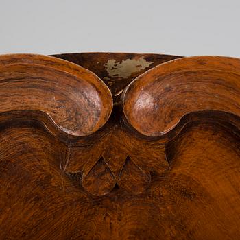 An 18th century cabinet with a clock.