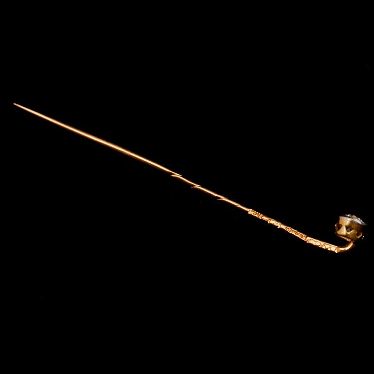 BROSCHNÅL, 18 k guld, med briljantslipad diamant.