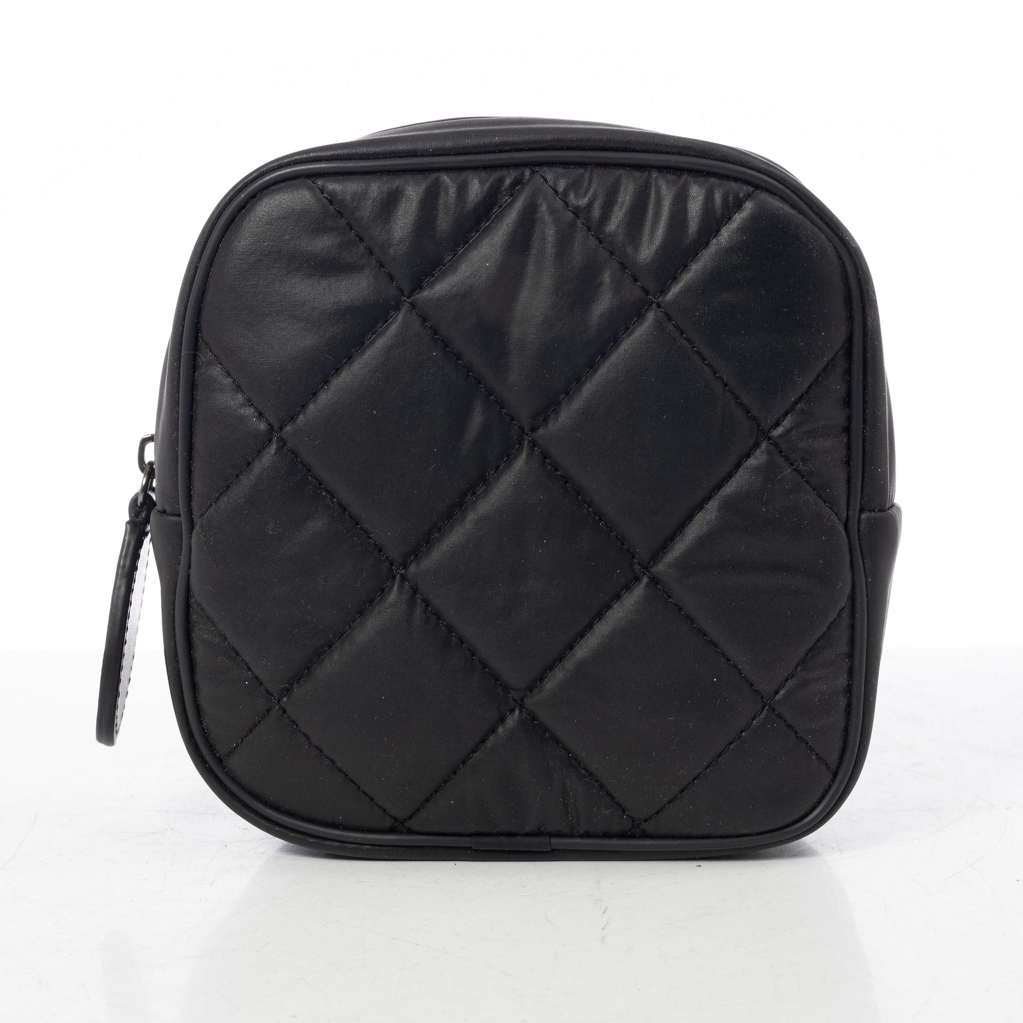 Chanel, tennis racket and 4 balls with case.