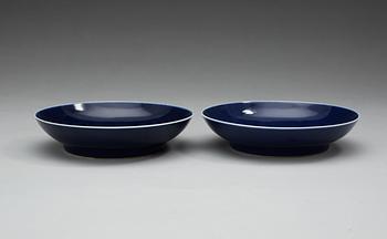A pair of blue glazed dishes, Qing dynasty, with Qianlongs seal mark.
