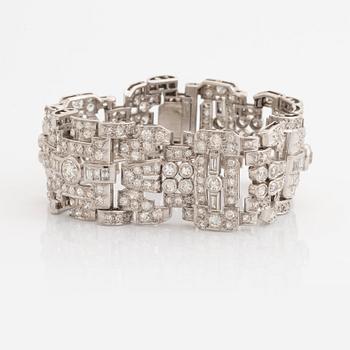 An 18K white gold bracelet set with old-, eight- and baguette-cut diamonds.