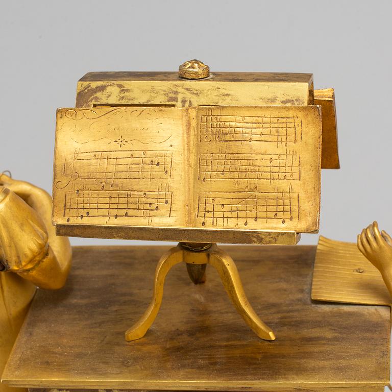 A French Empire gilt bronze mantel clock, first half of the 19th century.