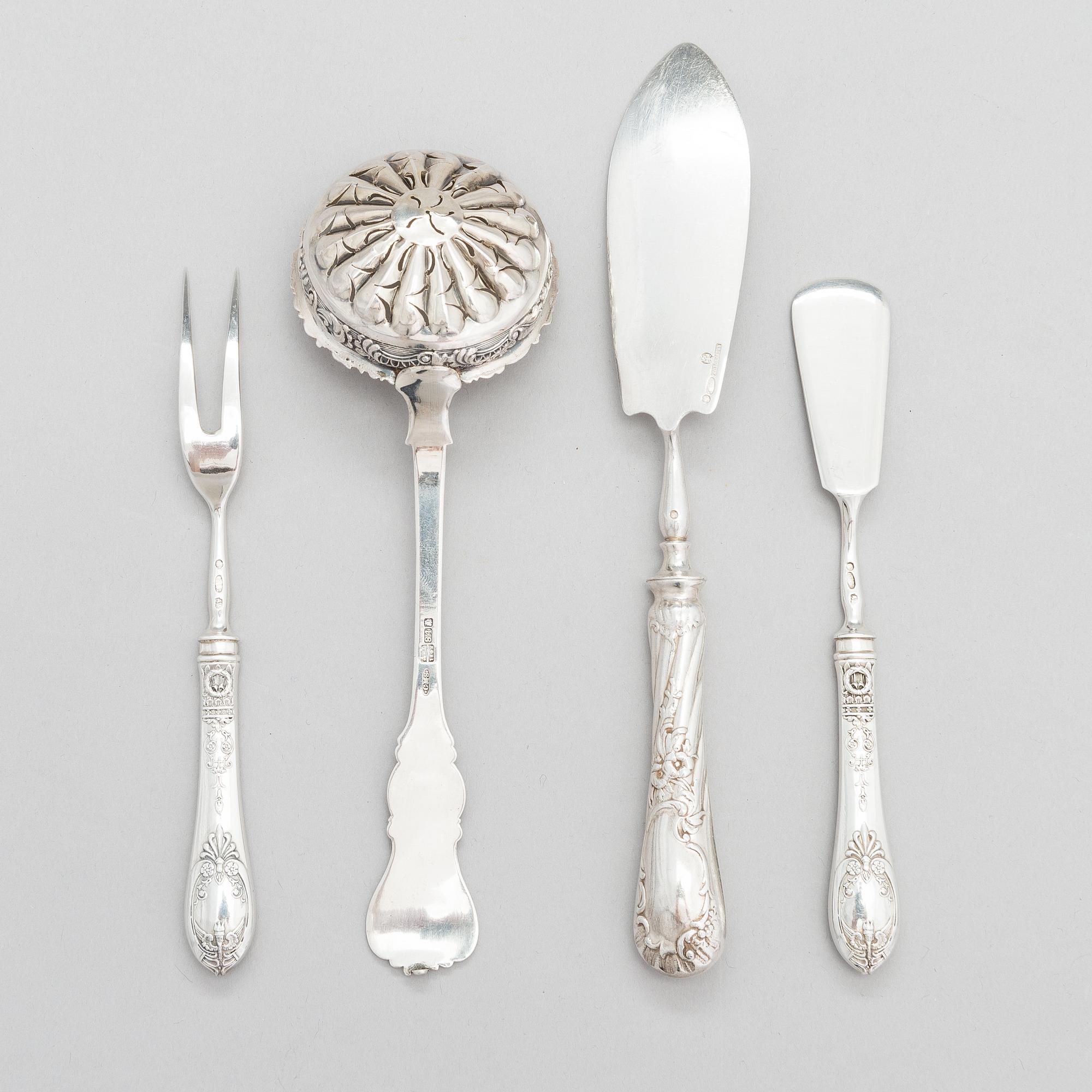 Four pieces of Russian silver cutlery.