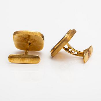 Avakian, a pair of 18K gold cufflinks with opas and diamonds ca. 0.26 ct in total.