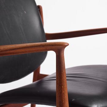 Finn Juhl, a teak and black leather 'model 136' easy chair, France & Daverkosen, Denmark 1950-60s.