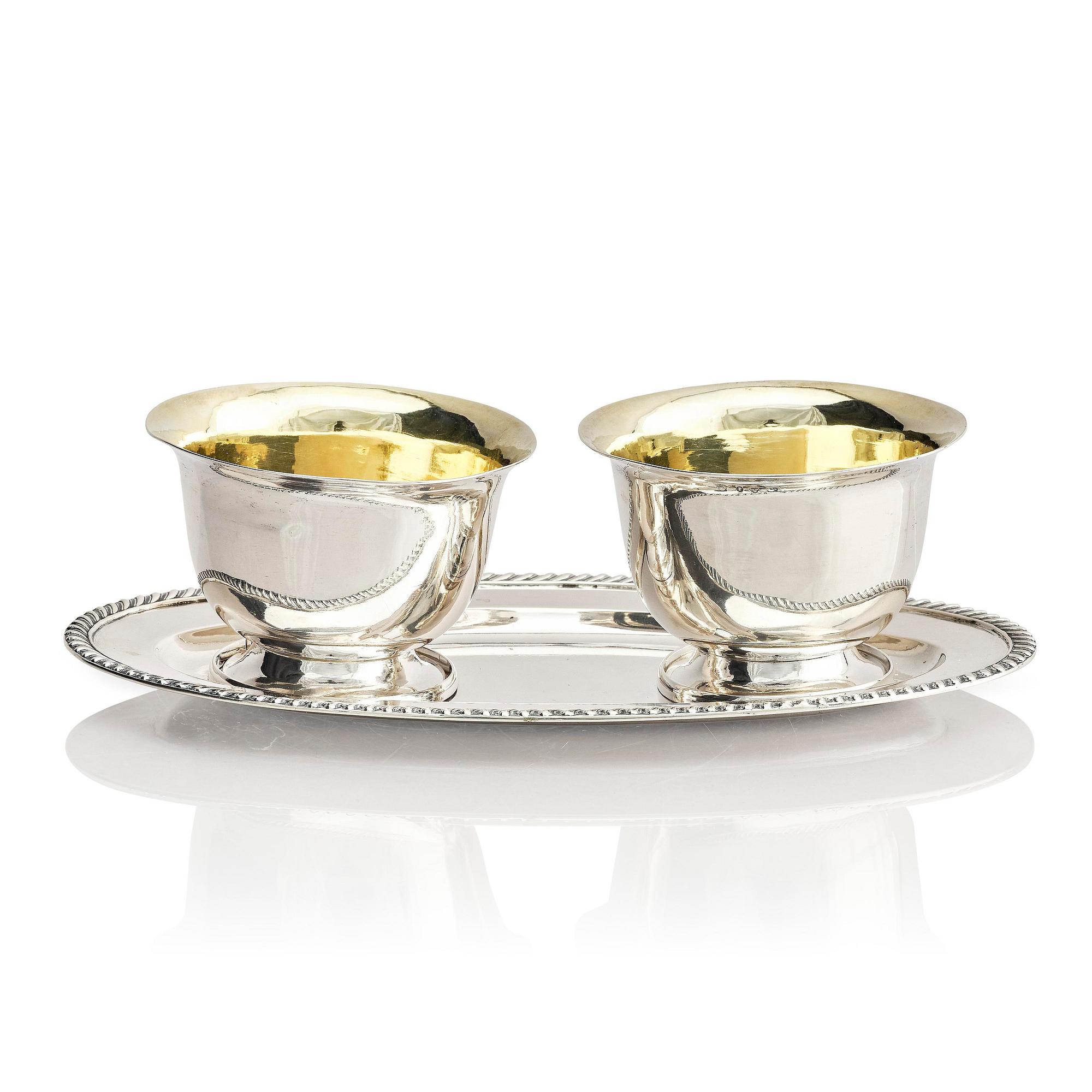 A pair of Swedish parcel-gilt silver dessert bowls with stand, mark of Gustaf Möllenborg, Stockholm 1830.