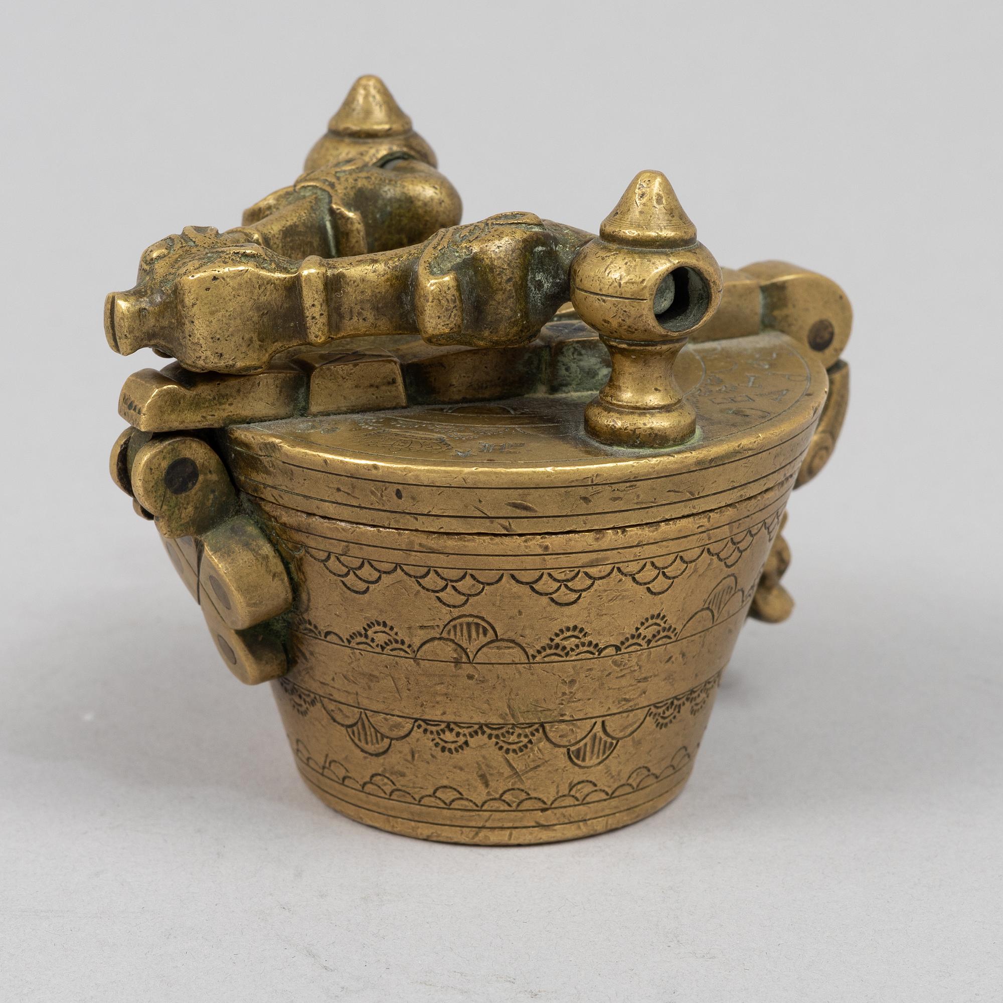 A brass weight set, late 19th century.