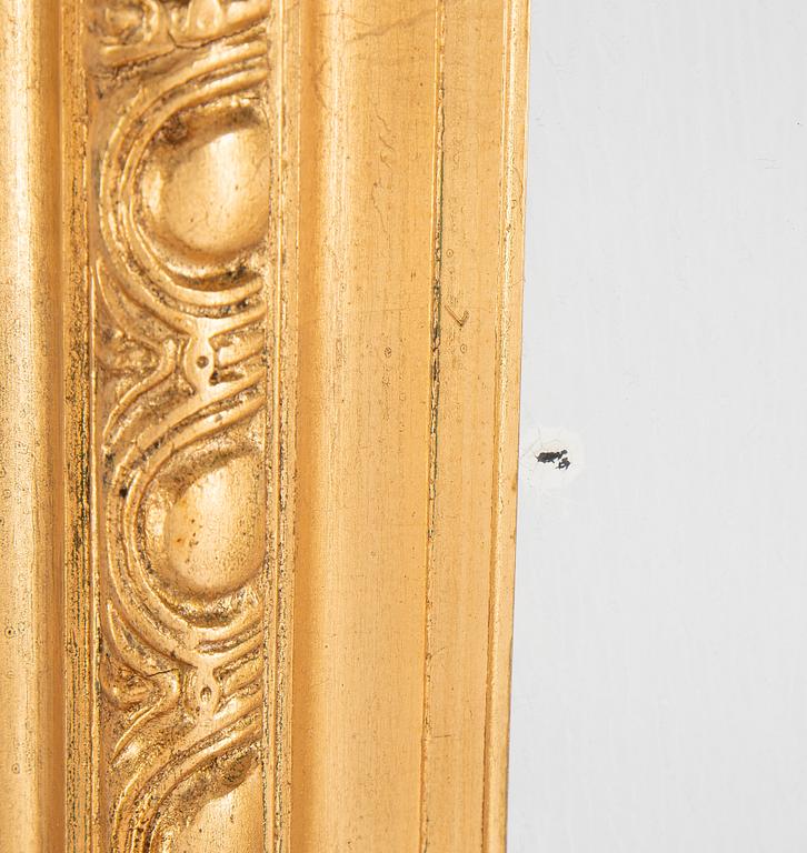 A mirror and console table from around the year 1900.