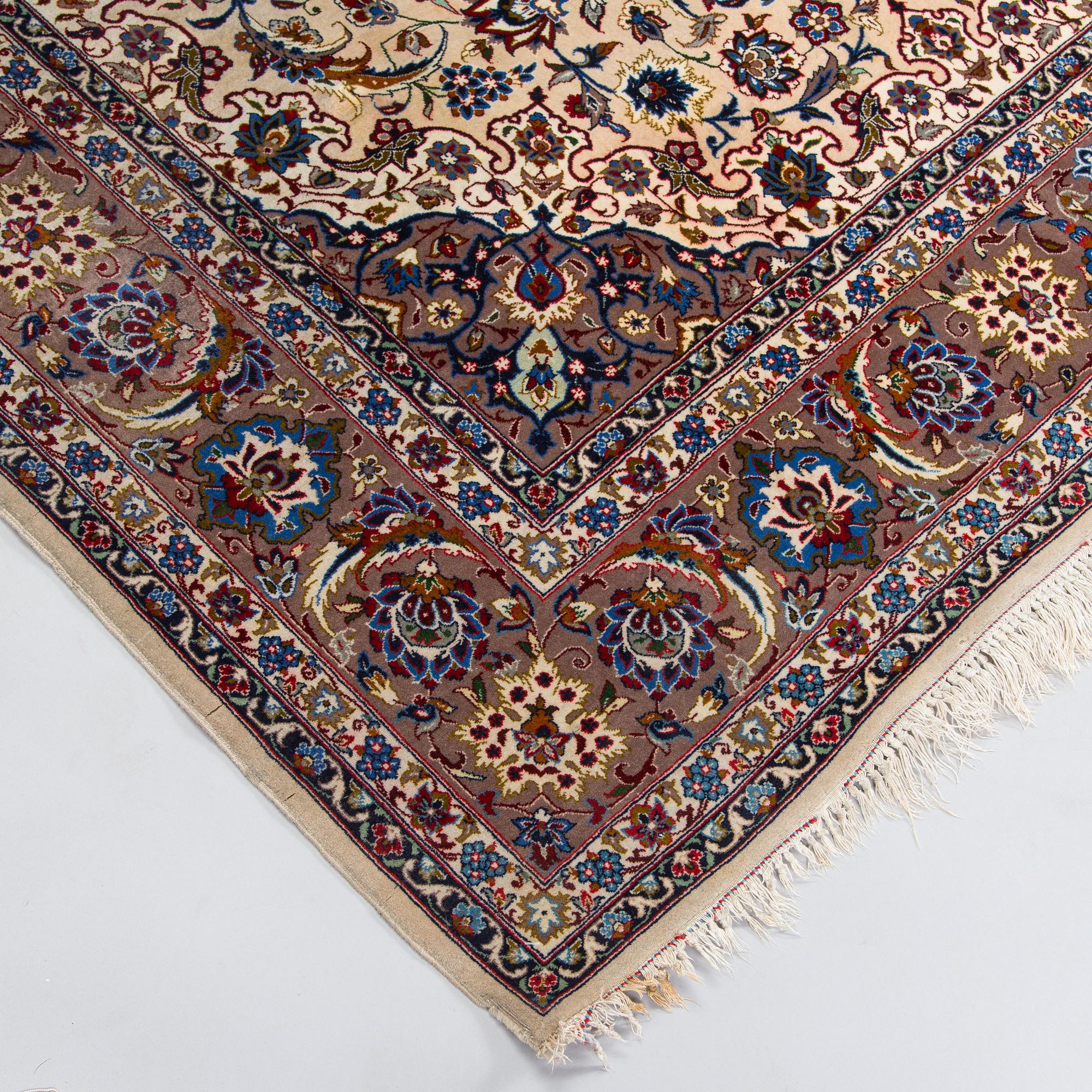 A semi-antique Isfahan rug, central Persia, signed c. 238 x 165 cm.