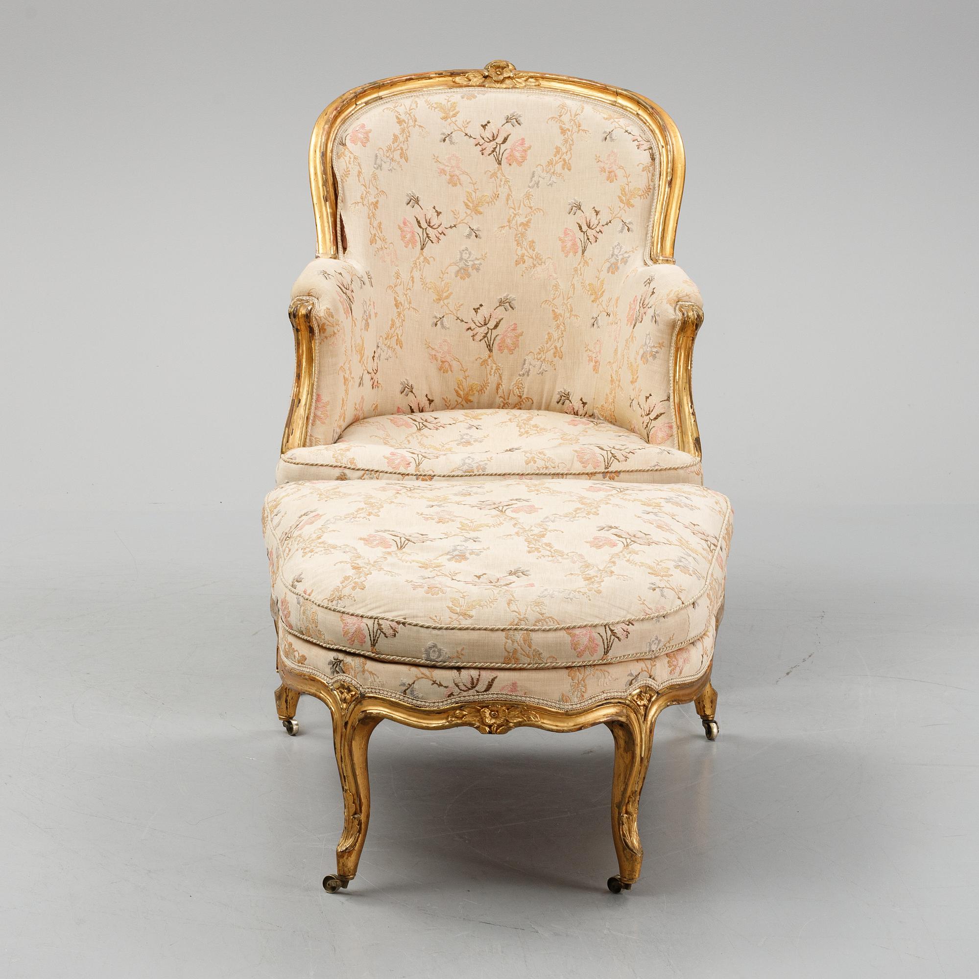 A Louis XV-style bergère armchair with stool, second half of the 19th century.