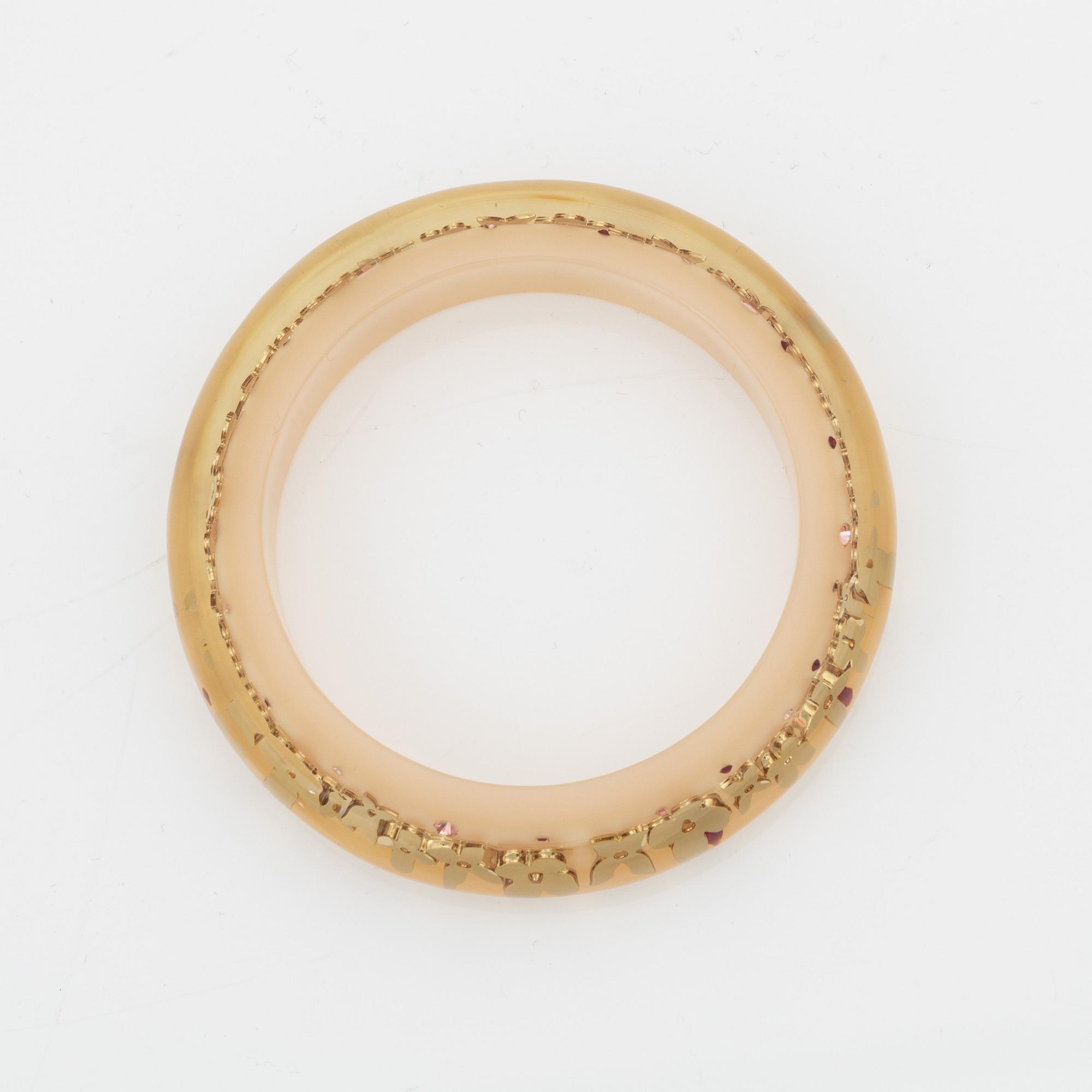 Louis Vuitton, inclusion bangle.