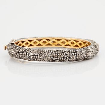 822. A BANGLE set with eight-cut diamonds.