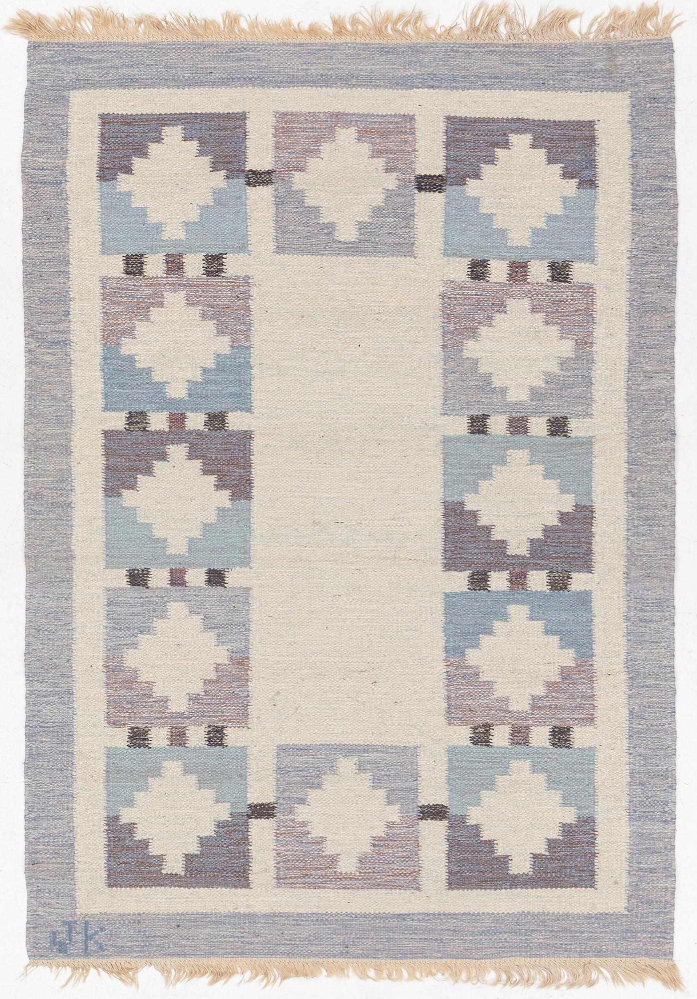 A flat weave rug, signed JK, approx. 195 x 137 cm.