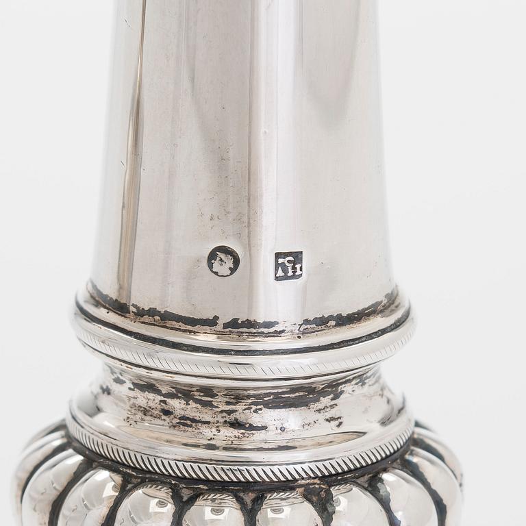 A pair of silver candlesticks, maker's mark of A. Homan, active in Amsterdam, 1817 – 1842.