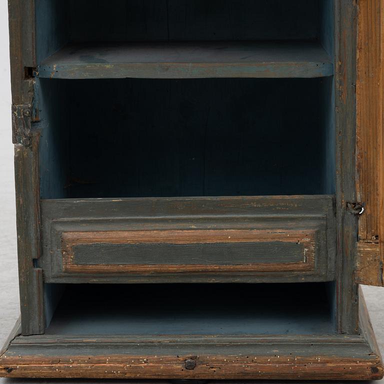 A painted wall cabinet, 19th century.
