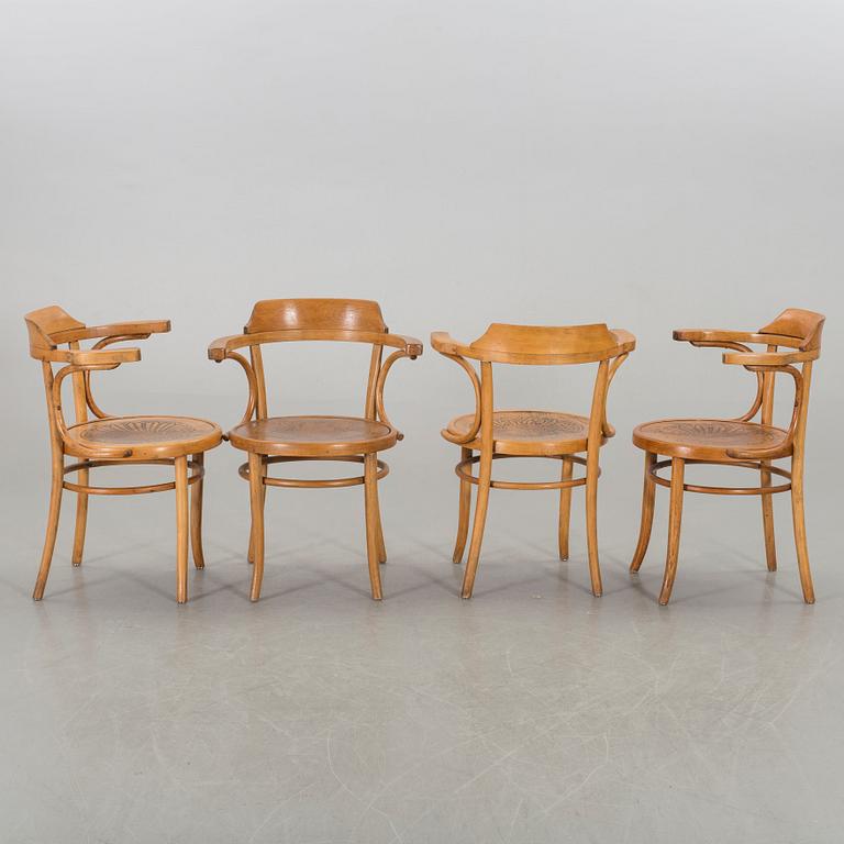 A set of four Cosmos arm chairs first half of the 20th century.