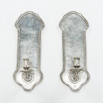 A pair of 1920s-30s tin sconces.