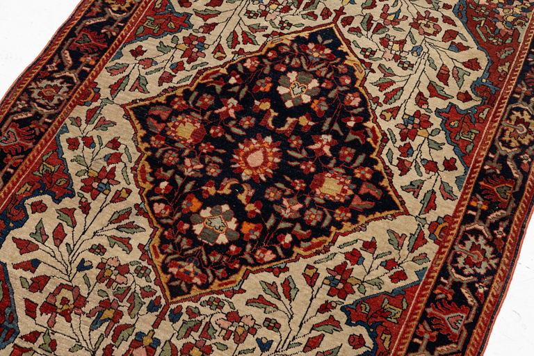 An antique Sarouk rug Western Iran, c 160 x 96 cm.