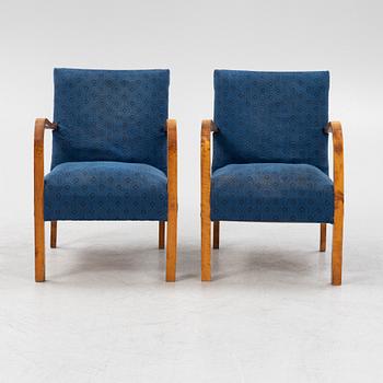 A a pair of stained birch armchairs 1930s-40s.