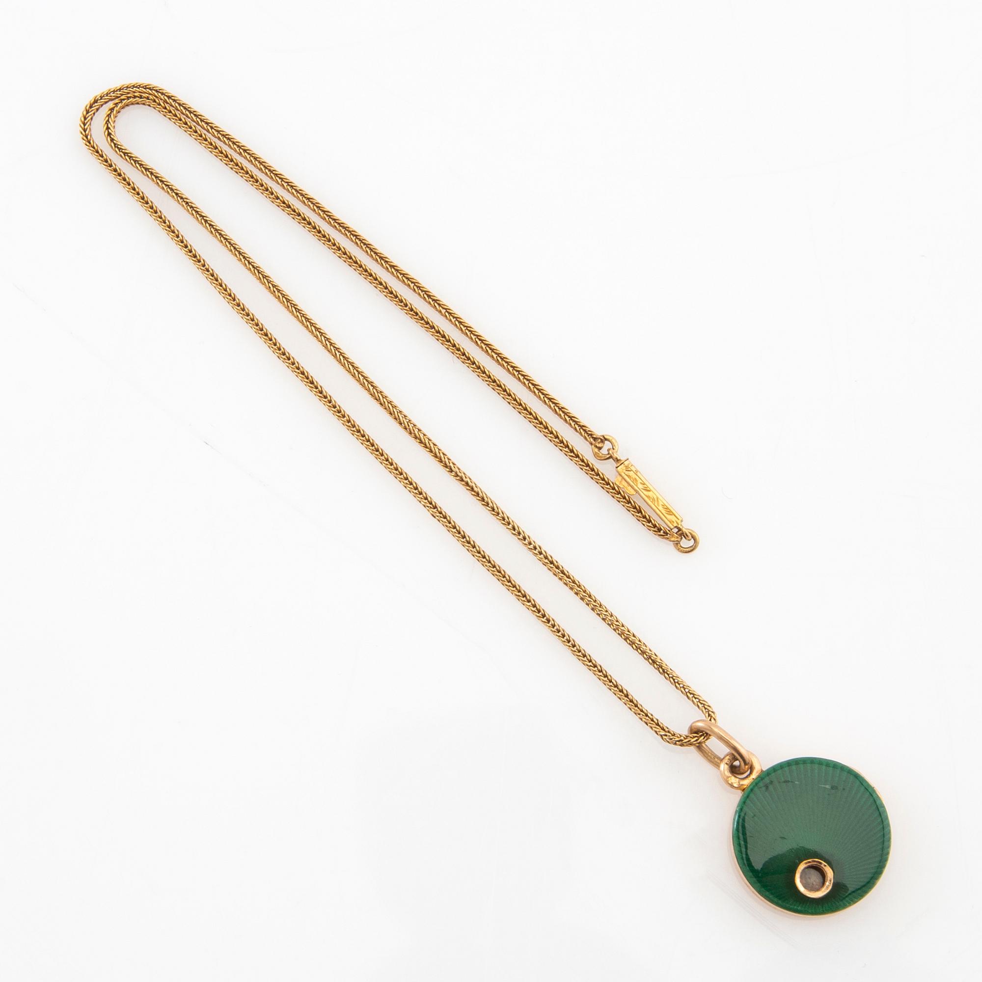 Halsband 18K guld med berlock.