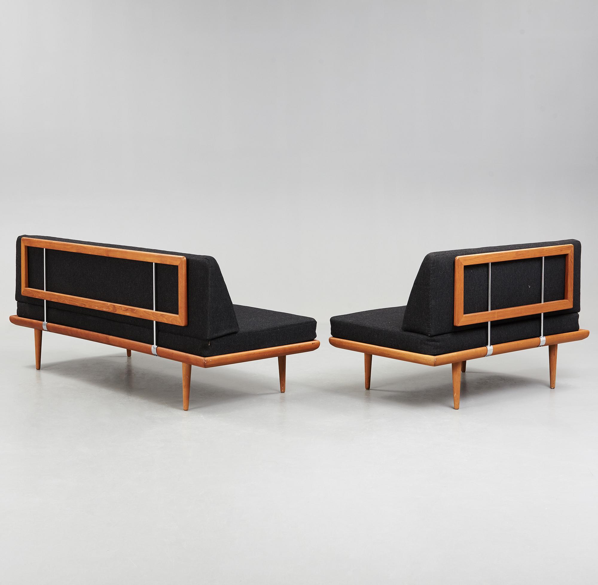 A set of two Danish 'Minerva' sofas with a table for France & Daverkosen.