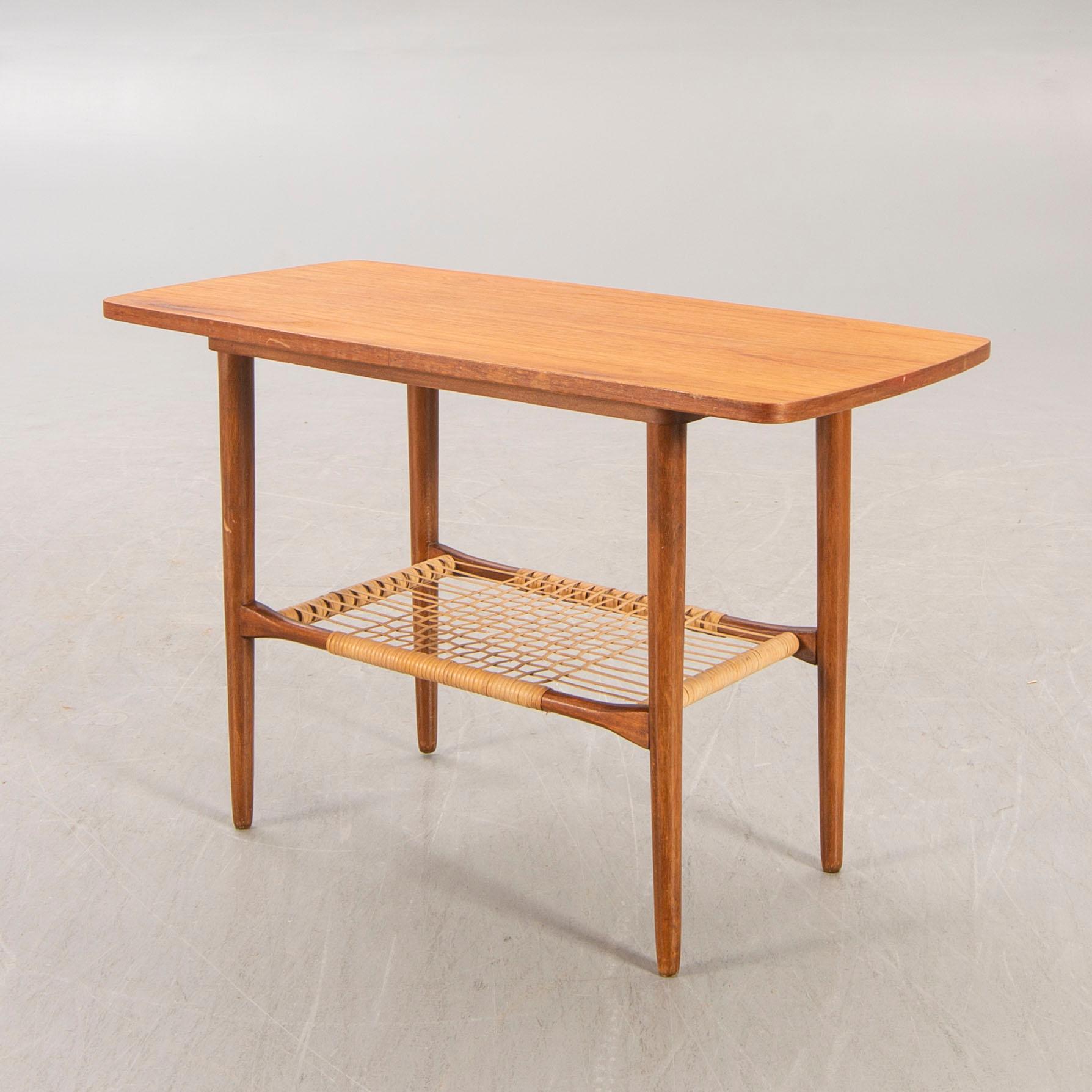 A teak and rattan 1960s coffee table.