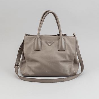 Prada, a leather handbag.
