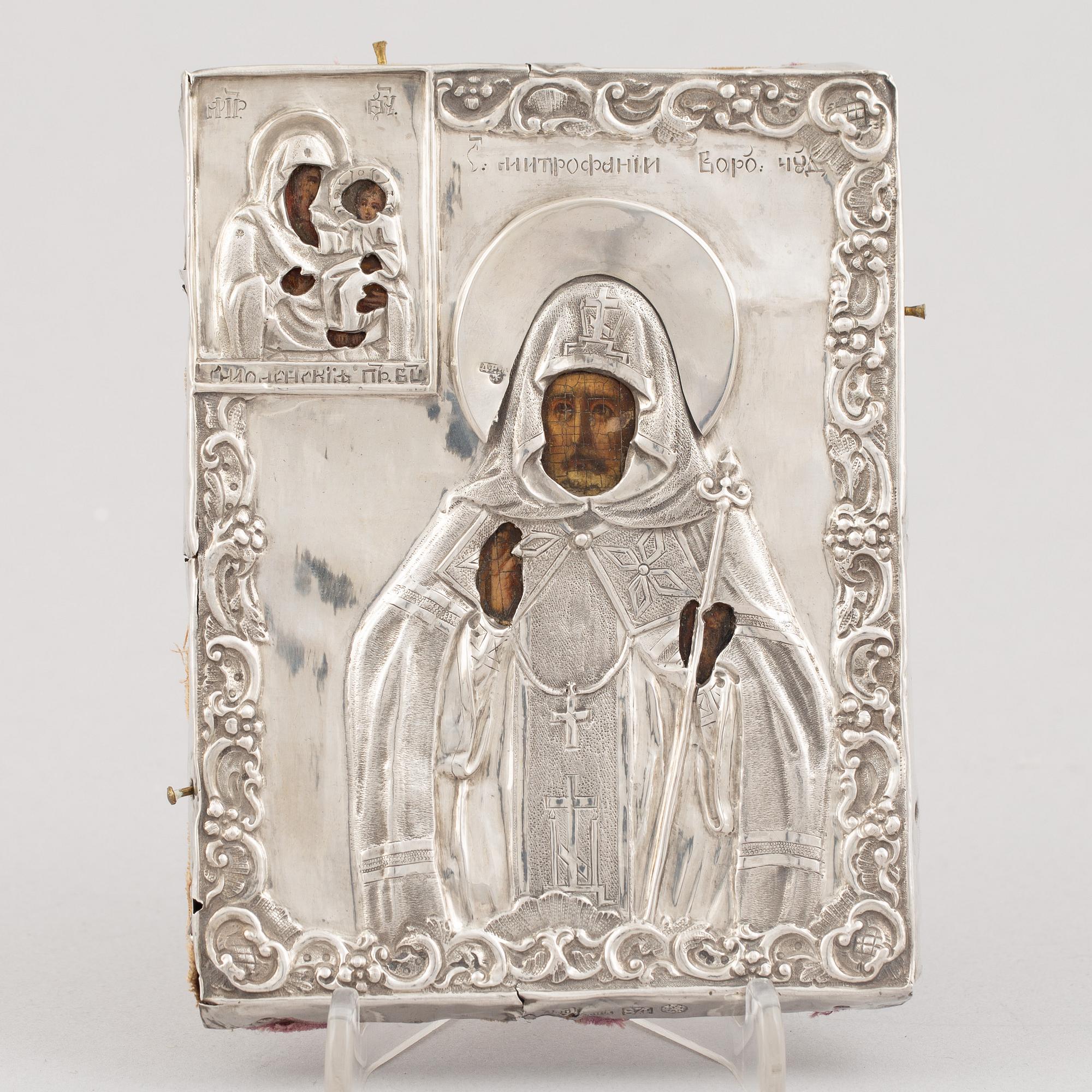 A Russian icon, with silver oklad, DN Dubinin (active 1849-54), St Petersburg.
