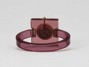 A purple plexiglass wrist-watch by Gucci.