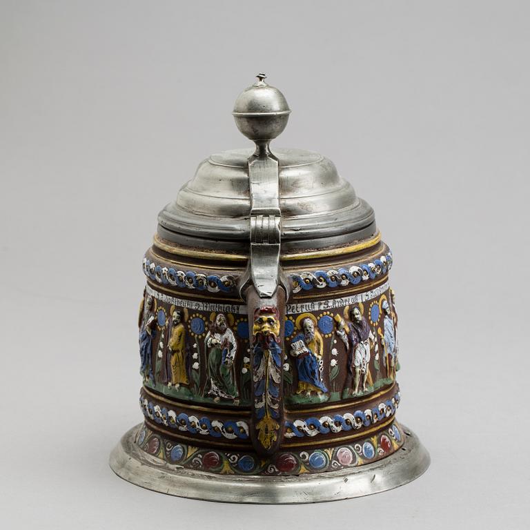 A GERMAN KREUSSEN STONEWARE APOSTLE STEIN TANKARD.