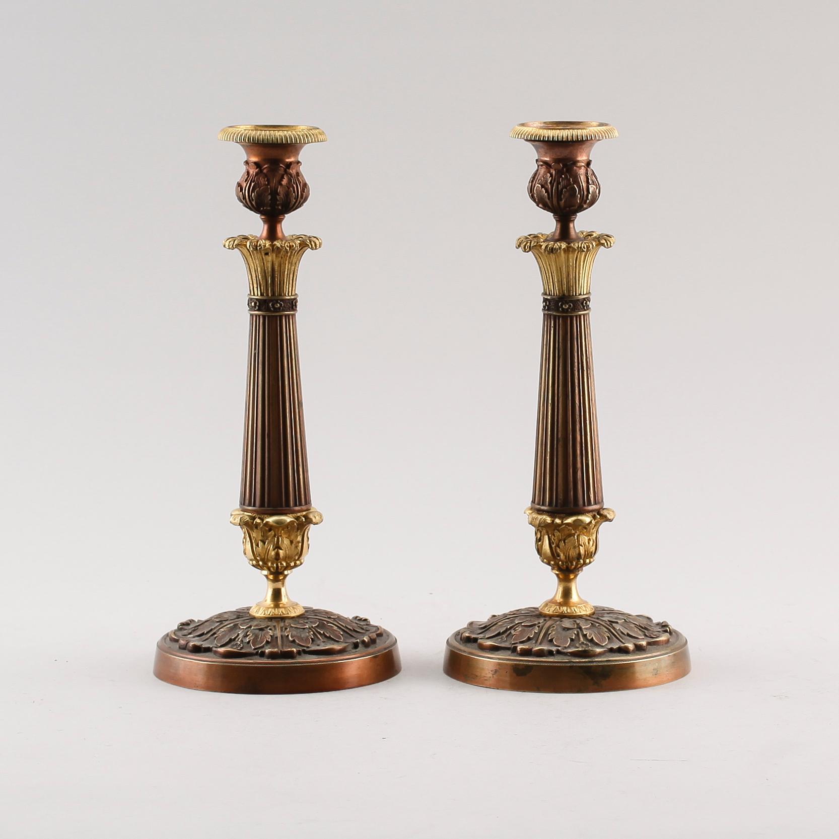 LJUSSTAKAR, 1 par, empire, förgylld och patinerad brons, 1800-talets första hälft.