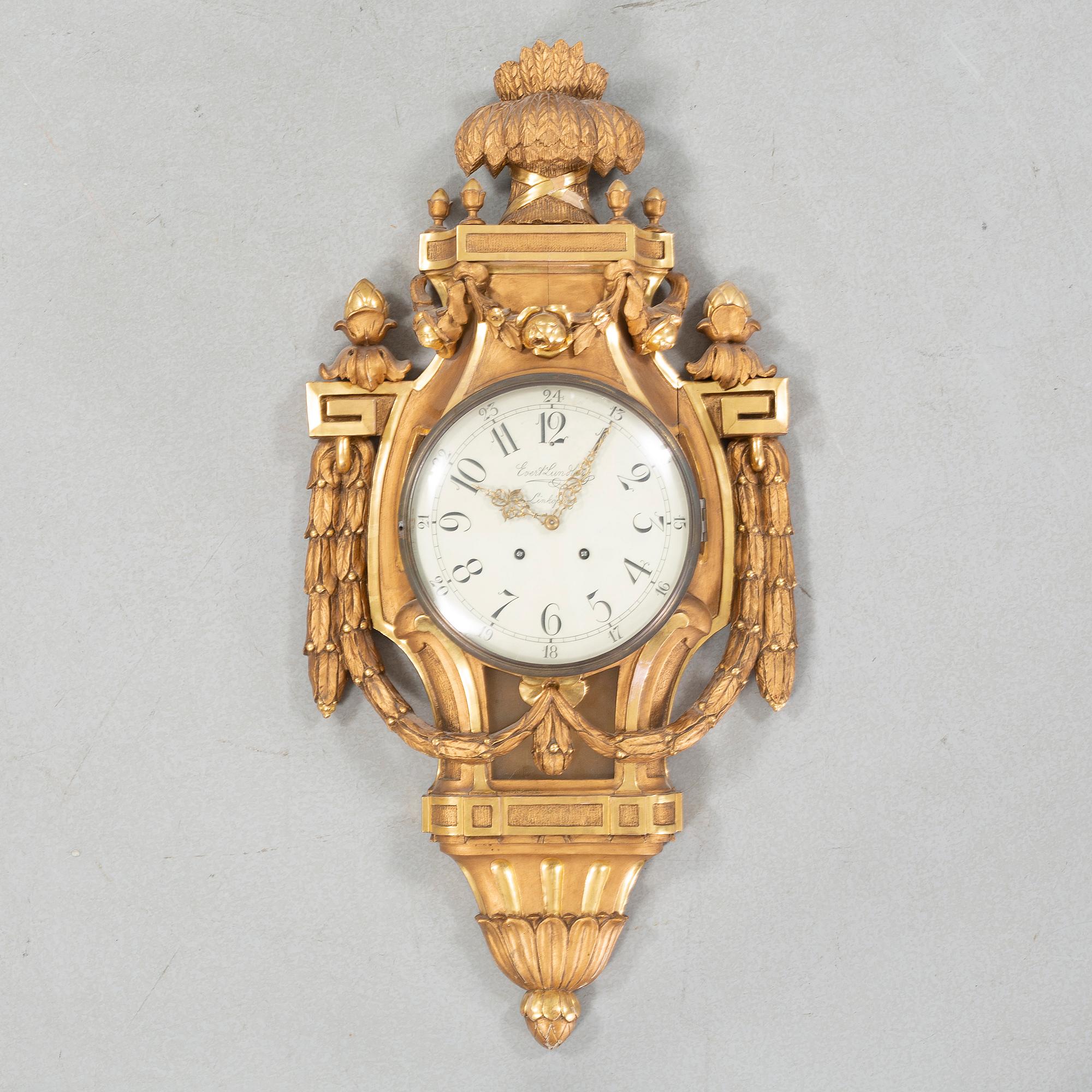 A wall clock marked Evert Lundberg Linköping from the first half of the 20th century.
