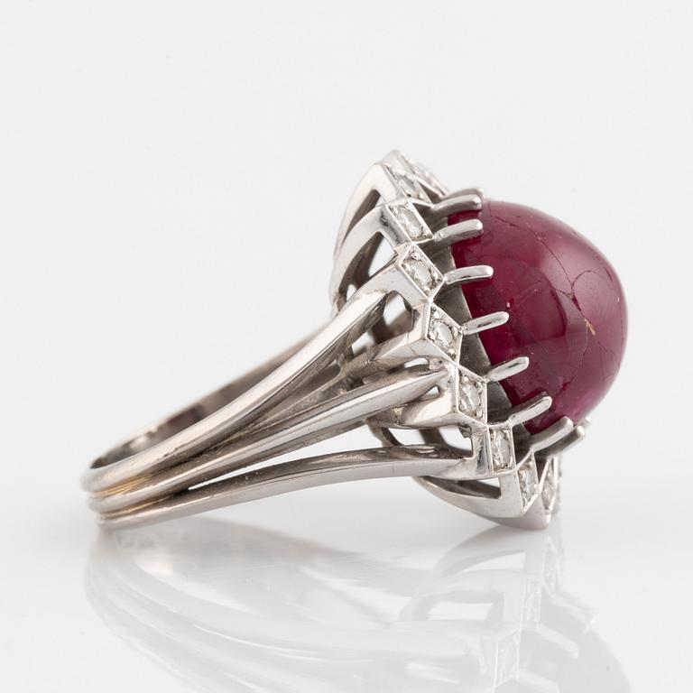 Ring, Strömdahls, with a cabochon-cut ruby and brilliant cut diamonds.