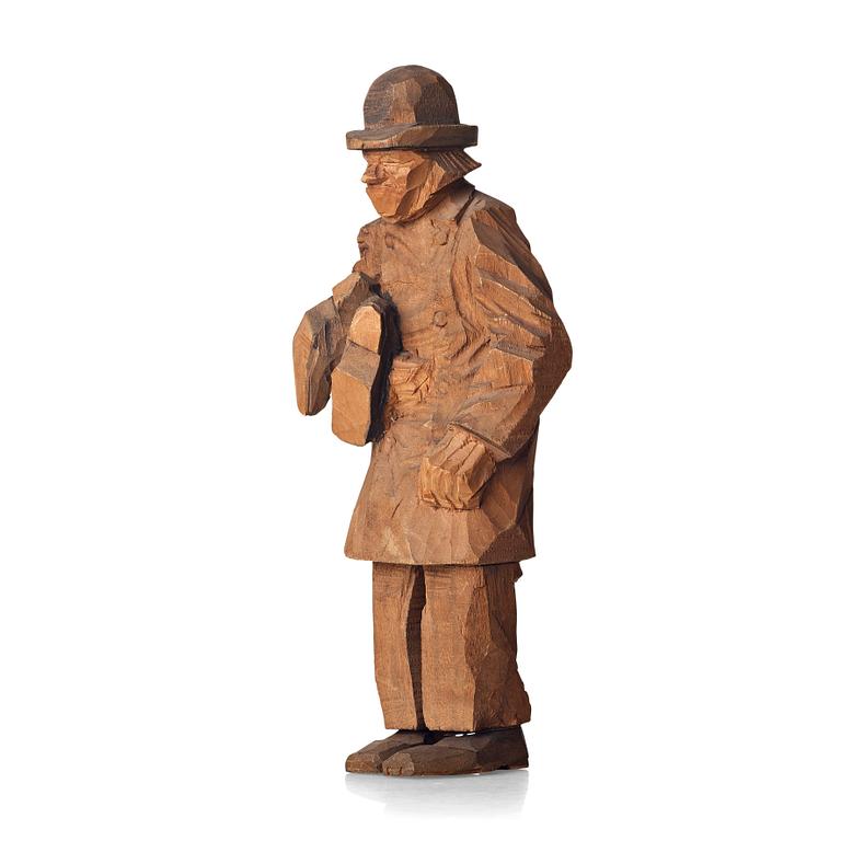 Axel Petersson Döderhultarn, Man holding boots.