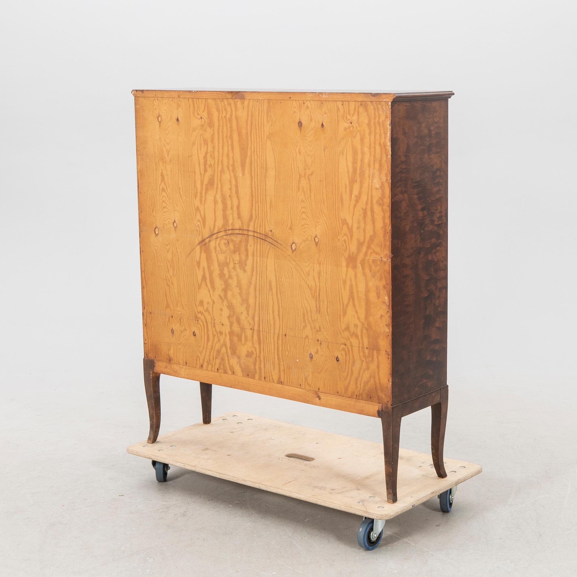 A 1920s  stained beech display cabinet.