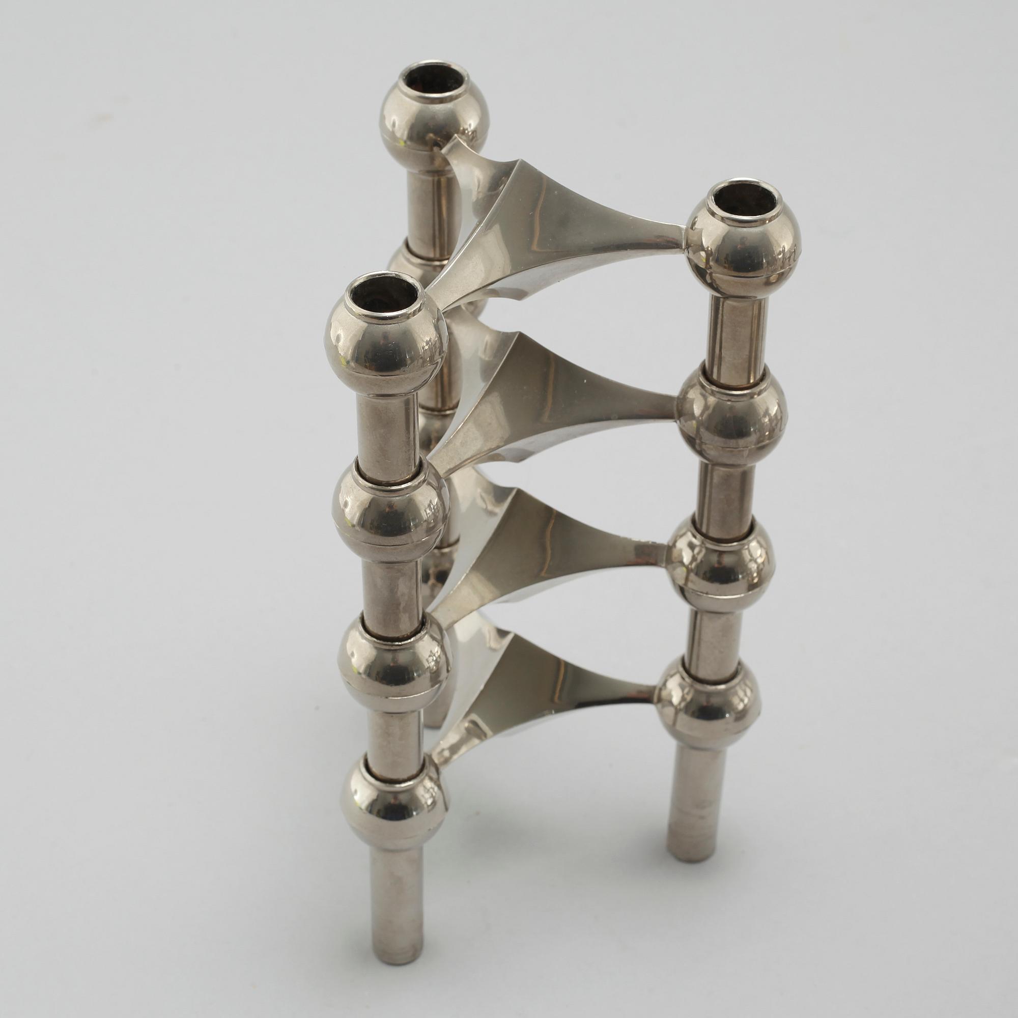 A metal candlestick with eleven parts by Ceasar Stoffi and Fritz Nagel, second half of the 20th century.