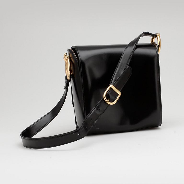 GIANFRANCO FERRÉ, a black leather shoulder bag.