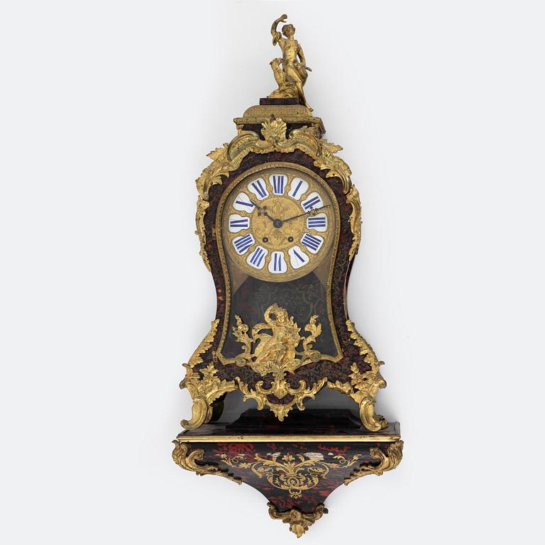 A faux tortoise and gilt bronze-mpunted Louis Xv-style cartel clock, late 19th century.