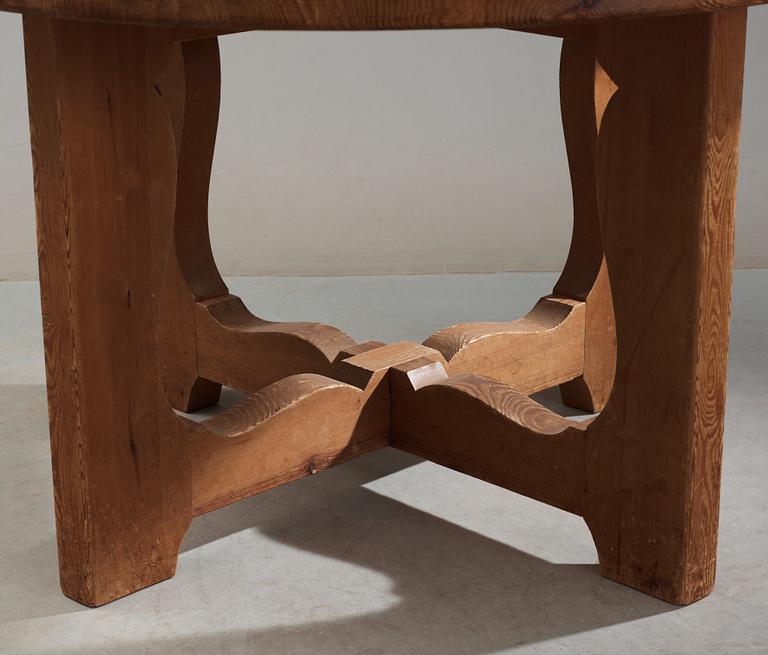 A stained pine dining table, attributed to Axel Einar Hjorth, Nordiska Kompaniet, 1930's.