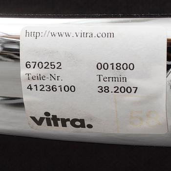 An 'EA 104 Swivel' armchair by Charles & Ray Eames, Vitra, 2007.