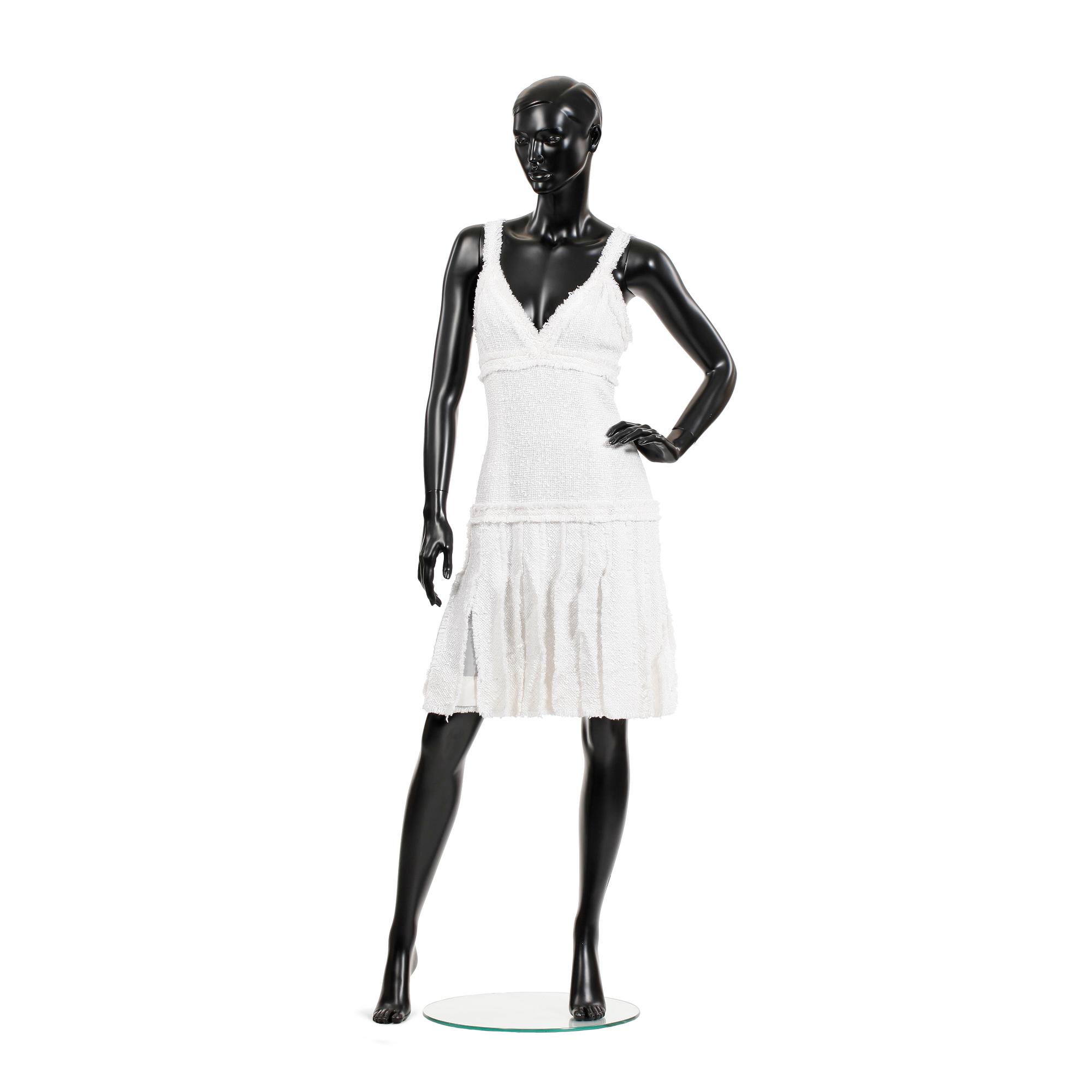 CHANEL, a white bouclé dress, 2004.