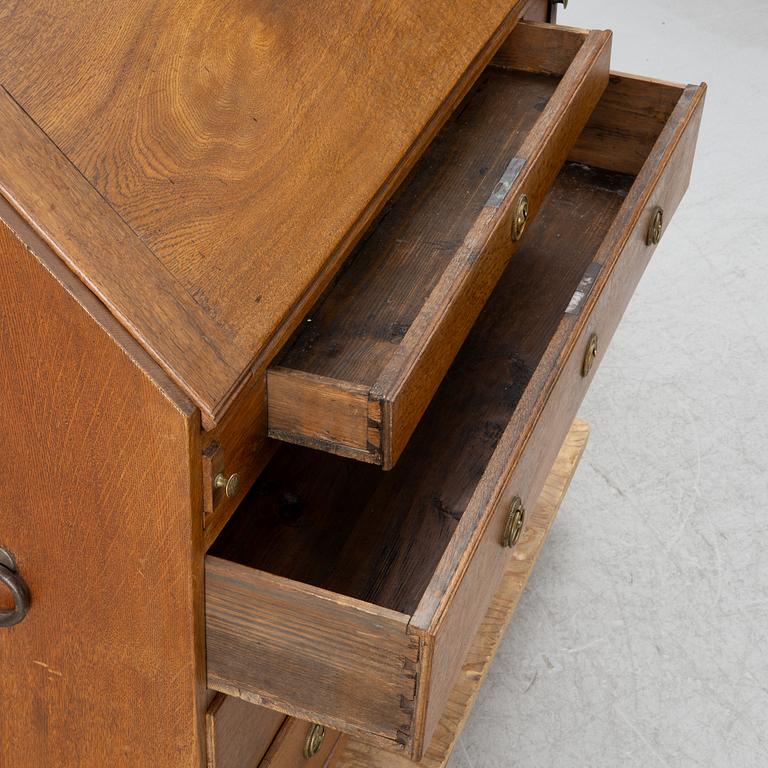 An oak secretaire, around 1800.