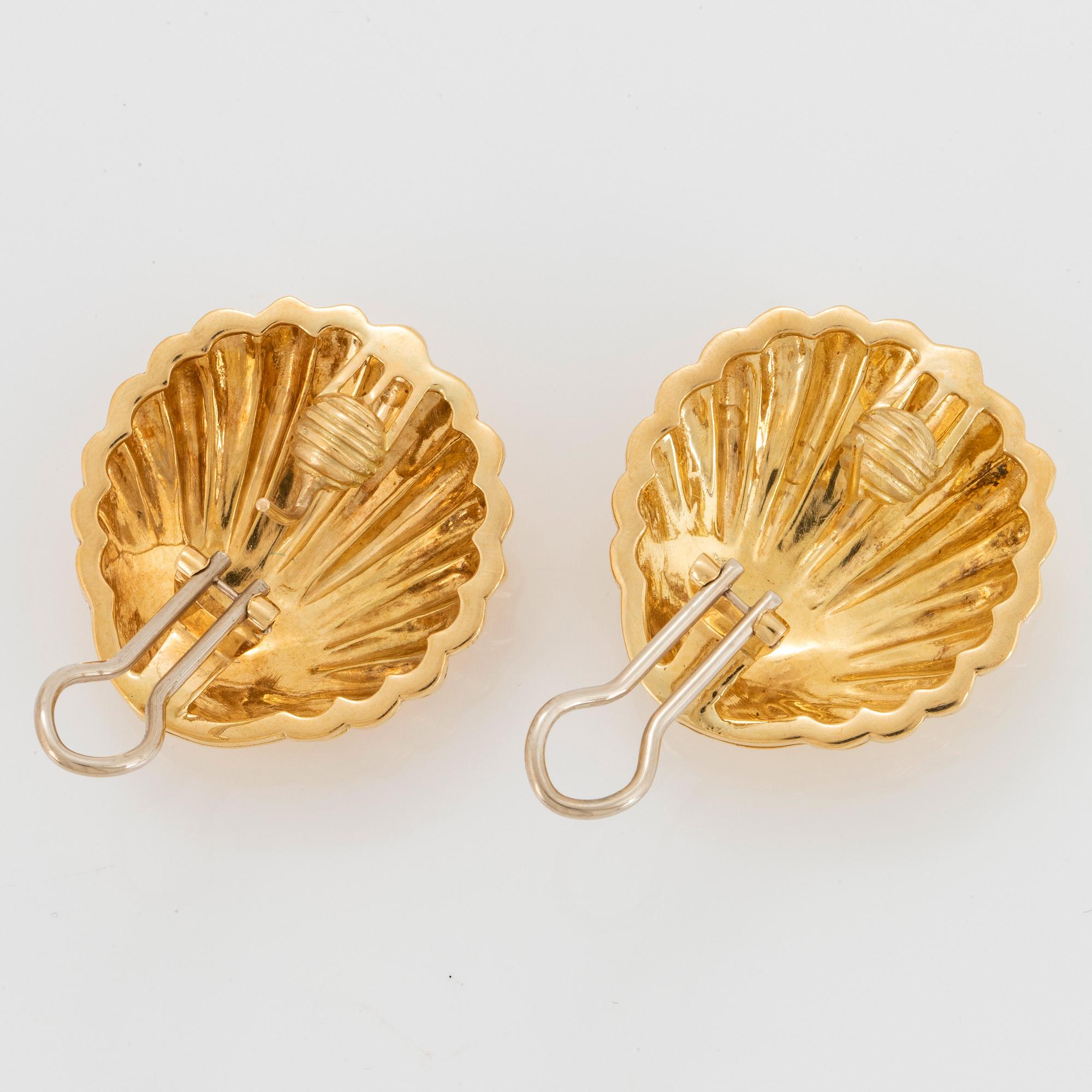 A pair of 18K gold earrings.