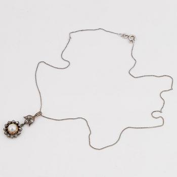 Old-cut diamond and pearl pendant.