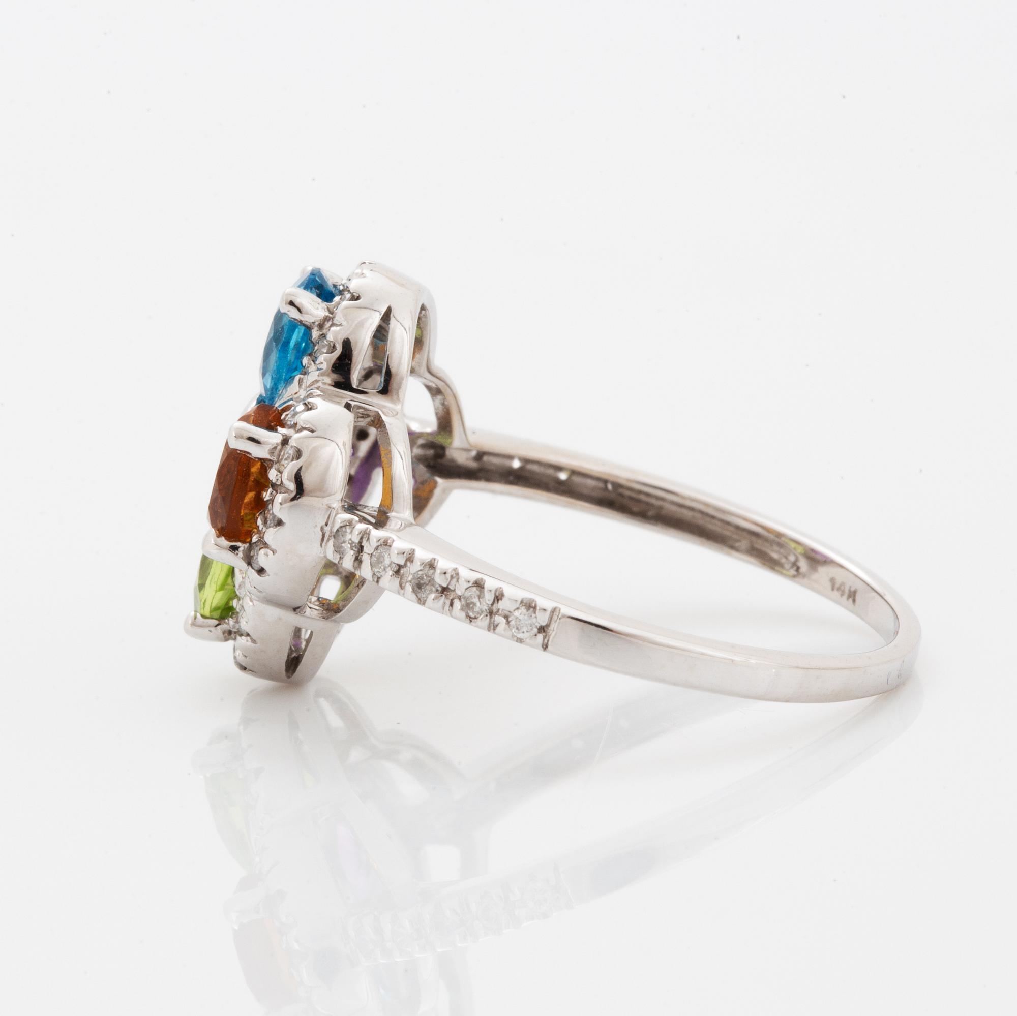Ring, med fasettslipad topas, ametist, peridot, citrin och briljantslipade diamanter i form av blomma.