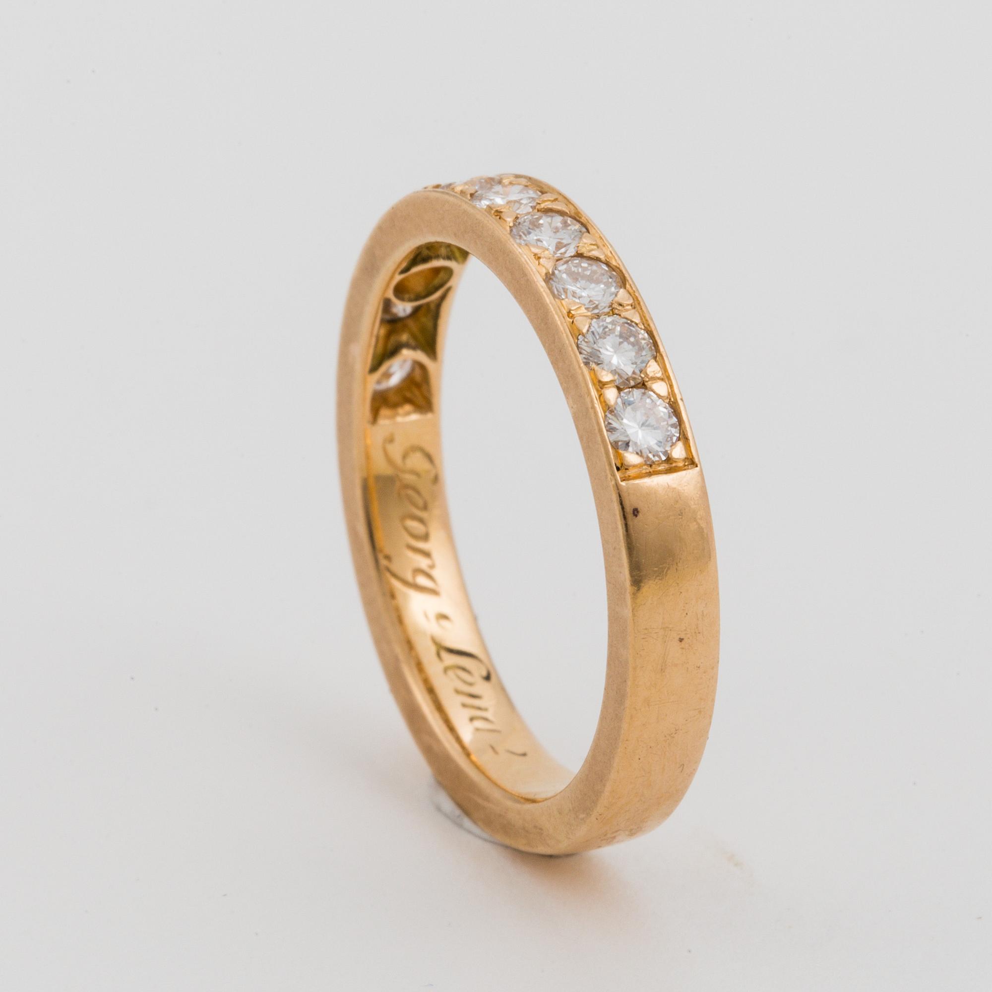 HALVALLIANSRING med briljantslipade diamanter.